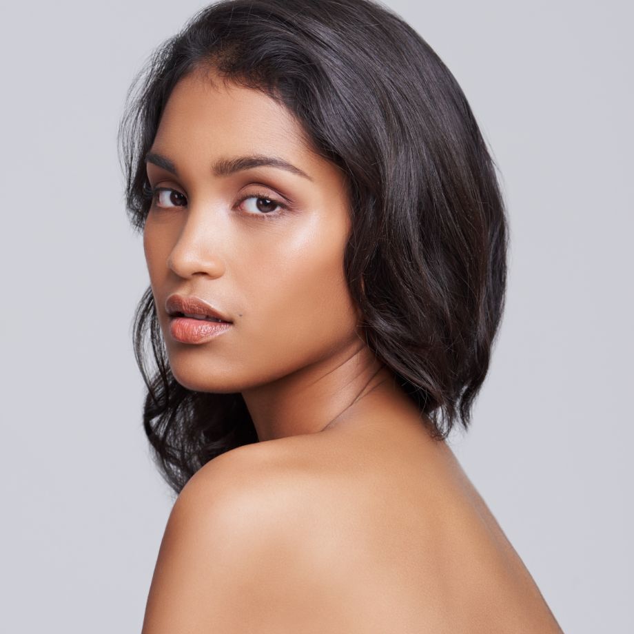 ethnic woman with wavy brown hair
