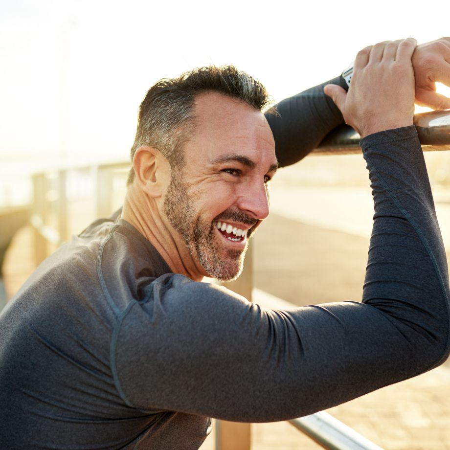 man at the beach working out